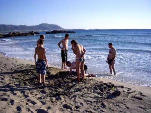 Family and the best man on the beach